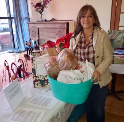 Attendees at the LWVGR Holiday Party, Sun., December 8, 2019, were generous with donations of toiletries, undergarments, and other necessities for refugee border detainees. Linda Zuba thanks everyone who contributed.
